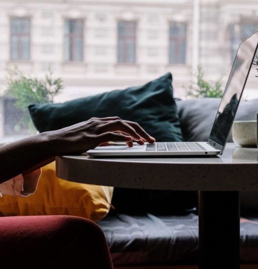 Man using laptop in apartment living room