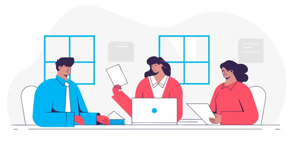 Consulting team meeting around a conference table discussing financial documents